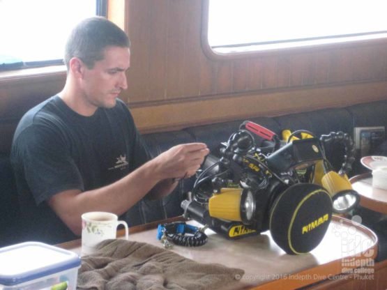 Digital Underwater Instructor assembling one of his cameras